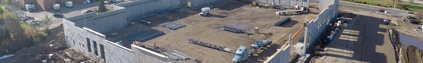 external wall of construction site for new grocery store