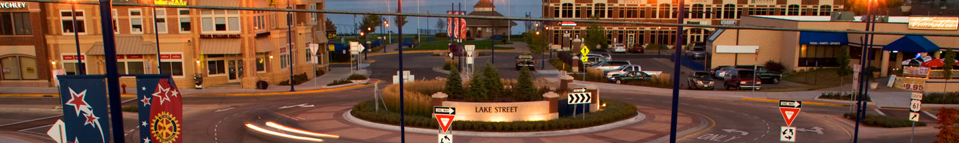 forest lake town round a bout with buildings and lake